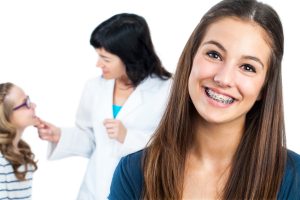 Teen girl smiling with braces