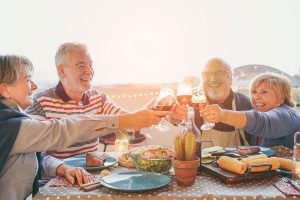 Older couples enjoy each other's company after their dentist appointments.