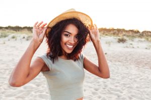 A woman has a stunningly bright smile after professional teeth whitening.