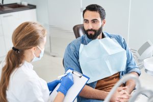 dentist speaking to patient