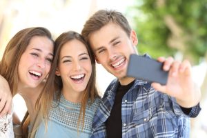 three friends taking a selfie