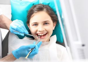 young girl getting a dental checkup